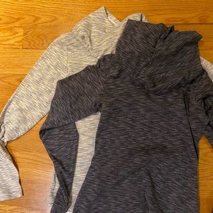 Bundle of two hooded long sleeve shirts.